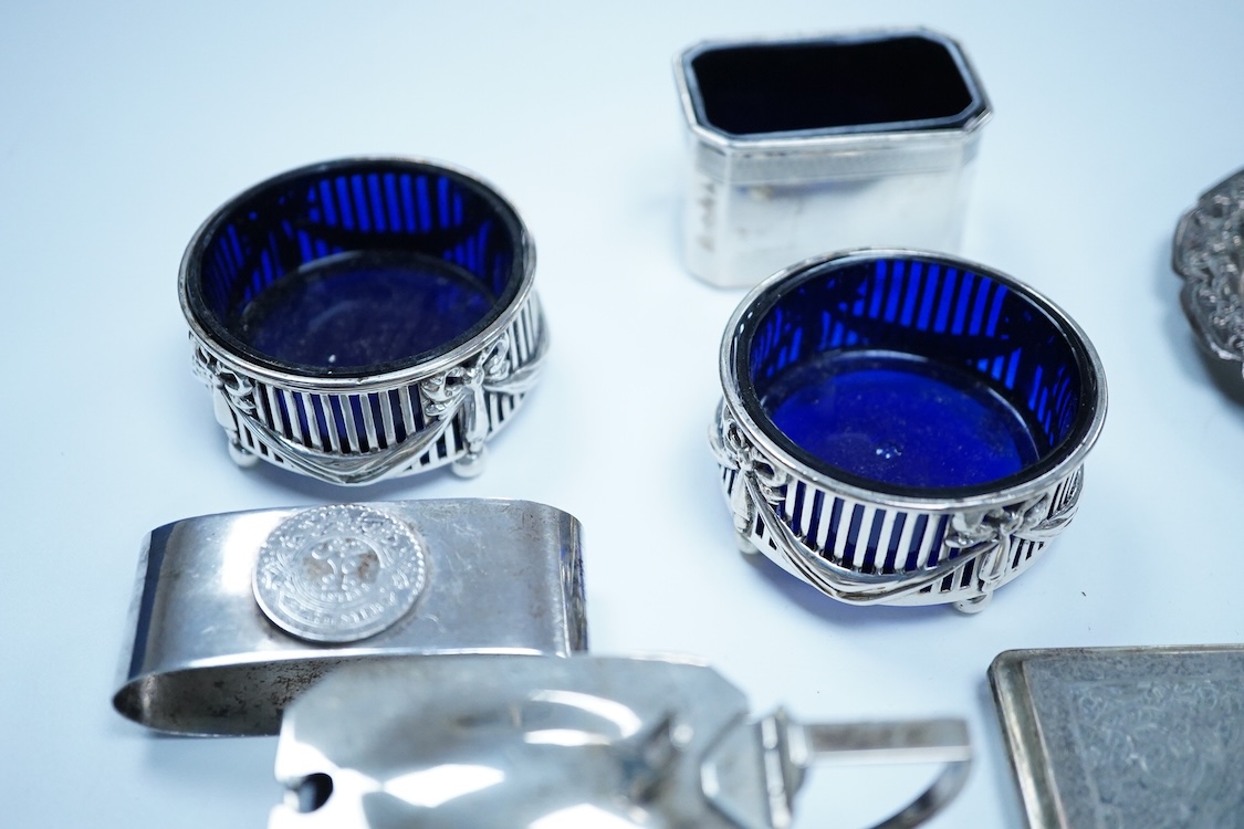 A small group of silver to include an Elizabeth II pierced shallow dish by Viners Ltd, Sheffield, 1957, diameter 12.4cm, a 1930's silver mounted cigarette box, a George III silver fiddle pattern sauce ladle and five silv